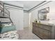 bedroom featuring a bunk bed, gray dresser, and closet for storage, with carpeted floors at 3588 Dahlia Dr, Haines City, FL 33844