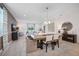 Elegant dining room with a wooden table, upholstered chairs, and open view to the living area at 3588 Dahlia Dr, Haines City, FL 33844