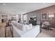 Open-concept living room with contemporary furnishings, recessed lighting, and an inviting atmosphere at 3588 Dahlia Dr, Haines City, FL 33844
