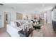 Spacious living room flowing into the dining area with modern decor and ample natural light at 3588 Dahlia Dr, Haines City, FL 33844