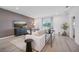 Cozy living room with stylish furnishings, a large window, and contemporary decor at 3588 Dahlia Dr, Haines City, FL 33844
