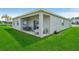 Covered patio with outdoor seating and views of the backyard at 3588 Dahlia Dr, Haines City, FL 33844