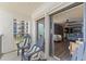 Balcony showcasing ocean views, outdoor seating, and seamless indoor-outdoor living with a sliding glass door at 3747 S Atlantic Ave # 2050, Daytona Beach, FL 32118