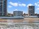 A gorgeous beachfront view of the condos, with waves crashing on the sandy shore at 3747 S Atlantic Ave # 2050, Daytona Beach, FL 32118