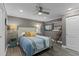 Bedroom with a comfortable bed, soft lighting, ceiling fan, and serene gray walls with white trim at 3747 S Atlantic Ave # 2050, Daytona Beach, FL 32118