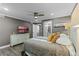 Bedroom with stylish decor, tv, ceiling fan, and access to a bathroom for added convenience at 3747 S Atlantic Ave # 2050, Daytona Beach, FL 32118