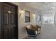 Hallway view with decorative wall texture, chairs, lighting and a glimpse of ocean view at 3747 S Atlantic Ave # 2050, Daytona Beach, FL 32118