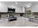 Kitchen featuring stainless steel appliances, granite countertops, and modern lighting at 3747 S Atlantic Ave # 2050, Daytona Beach, FL 32118