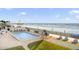 Relaxing pool deck features lounge chairs, shuffleboard court, and beach access at 3747 S Atlantic Ave # 2050, Daytona Beach, FL 32118