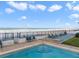 Relaxing community pool deck features lounge chairs and beach access at 3747 S Atlantic Ave # 2050, Daytona Beach, FL 32118