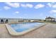 Community pool with lounge chairs overlooking beach with private gazebo at 3747 S Atlantic Ave # 2050, Daytona Beach, FL 32118