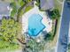 Aerial view of a community pool with tables, chairs and landscaping at 396 Newton, Longwood, FL 32779