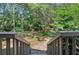 Backyard view from deck with lush greenery and mature trees at 396 Newton, Longwood, FL 32779