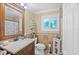 Bathroom with granite vanity, sink, and tiled shower at 396 Newton, Longwood, FL 32779