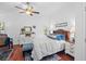 Comfortable bedroom features a ceiling fan, hardwood floors, and an ensuite bathroom at 396 Newton, Longwood, FL 32779