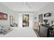 Bright bedroom with slider leading to the outdoors and comfortable furnishings at 396 Newton, Longwood, FL 32779