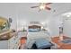 Comfortable bedroom features a ceiling fan, hardwood floors, and an ensuite bathroom at 396 Newton, Longwood, FL 32779