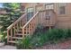Exterior deck with wooden stairs and lush tropical landscaping at 396 Newton, Longwood, FL 32779