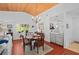 Cozy dining area with wood ceiling, wet bar and window view of lush greenery at 396 Newton, Longwood, FL 32779
