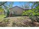 Home's exterior with deck, lush landscaping and mature trees at 396 Newton, Longwood, FL 32779