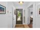 Bright foyer with tiled floor, decorative wreath, and view into adjacent rooms at 396 Newton, Longwood, FL 32779