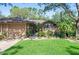 Charming home with well-manicured lawn, mature landscaping, and gated entrance at 396 Newton, Longwood, FL 32779