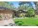 Charming home exterior with a well-manicured lawn and landscaping at 396 Newton, Longwood, FL 32779