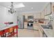 Bright kitchen features stainless appliances, white cabinets, and a decorative backsplash at 396 Newton, Longwood, FL 32779