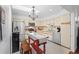 Bright kitchen features stainless appliances, white cabinets, and a decorative backsplash at 396 Newton, Longwood, FL 32779