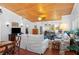 Bright living room with a wood ceiling, comfortable seating, and open floor plan at 396 Newton, Longwood, FL 32779