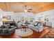 Spacious living room with a wood ceiling, fireplace, and natural light at 396 Newton, Longwood, FL 32779