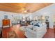 Elegant living room with a wood ceiling, fireplace, and views into other living spaces at 396 Newton, Longwood, FL 32779