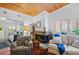 Cozy living room with stone fireplace, wood ceiling and comfortable seating arrangement at 396 Newton, Longwood, FL 32779