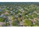 High aerial perspective of a residential neighborhood with lush greenery and winding streets at 4011 Teriwood Ave, Orlando, FL 32812