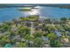 Breathtaking aerial vista of a neighborhood bordering a vast lake with visible shorelines and islands at 4011 Teriwood Ave, Orlando, FL 32812