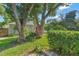 Well-manicured backyard showcasing a variety of plants and trees, adding natural beauty and charm to the property at 4011 Teriwood Ave, Orlando, FL 32812