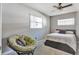 Cozy bedroom featuring natural light, a ceiling fan, and comfortable furnishings at 4011 Teriwood Ave, Orlando, FL 32812
