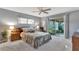 Comfortable bedroom with sliding door to lanai, neutral colors and ceiling fan at 4011 Teriwood Ave, Orlando, FL 32812