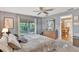 Serene bedroom featuring a sliding glass door to the lanai and a neutral color palette at 4011 Teriwood Ave, Orlando, FL 32812