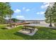 Picturesque lake view from the community park, furnished with picnic tables and a dock at 4011 Teriwood Ave, Orlando, FL 32812