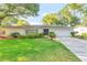 Charming single-story home with a well-maintained lawn, mature trees, and a double door entryway at 4011 Teriwood Ave, Orlando, FL 32812