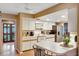 Bright kitchen featuring white cabinets, an eat-in area, and modern appliances at 4011 Teriwood Ave, Orlando, FL 32812