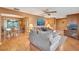 Open concept living and dining area with hardwood floors, and views of the outdoor patio at 4011 Teriwood Ave, Orlando, FL 32812