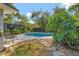 A private pool area features stepping stones and lush tropical landscaping, offering a peaceful outdoor retreat at 4011 Teriwood Ave, Orlando, FL 32812