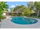 Beautiful pool surrounded by a patio offers a serene outdoor space for relaxation and recreation at 4011 Teriwood Ave, Orlando, FL 32812