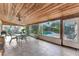 Bright, airy sun room with wood ceiling, tile floor, and lovely views of the outdoor pool area at 4011 Teriwood Ave, Orlando, FL 32812