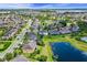 Beautiful aerial view of a neighborhood with a tranquil lake in the background at 408 Egret Place Dr, Winter Garden, FL 34787