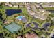 Aerial view of the community featuring a pool, tennis court, playground, and lush landscaping at 408 Egret Place Dr, Winter Garden, FL 34787