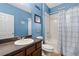 Comfortable bathroom features a single sink vanity and a shower-tub combination at 408 Egret Place Dr, Winter Garden, FL 34787
