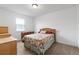 Bedroom featuring carpet flooring, natural lighting, and a ceiling light at 408 Egret Place Dr, Winter Garden, FL 34787